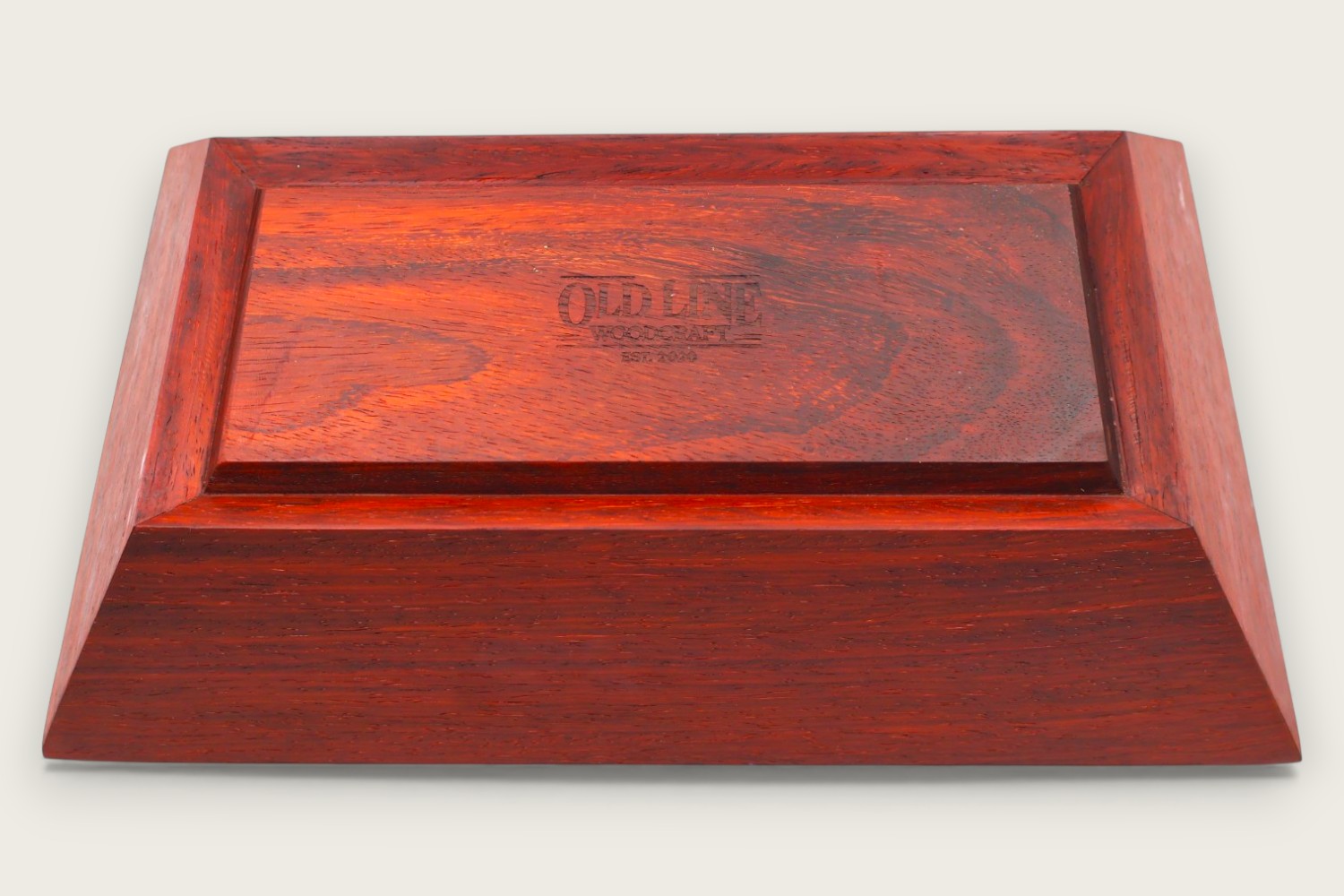 Padauk catch-all bowl with horizontal face grain, rectangular shape, warm reddish tones, and a tung oil finish.